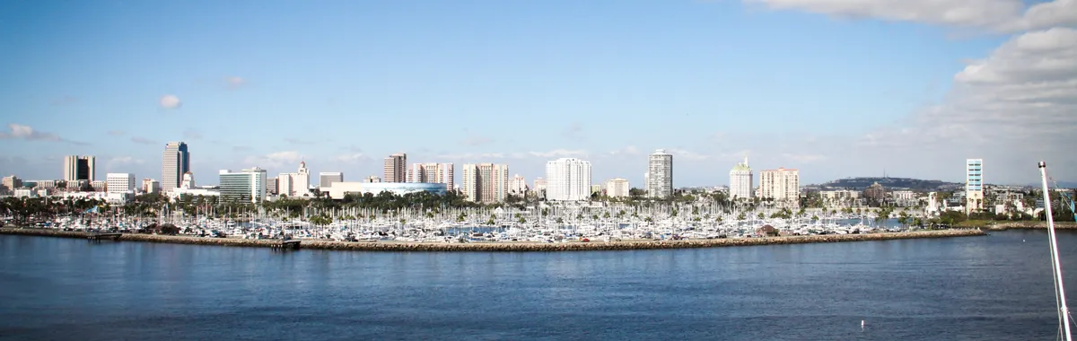 Stunning view of Long Beach city skyline and waterfront under a clear blue sky.