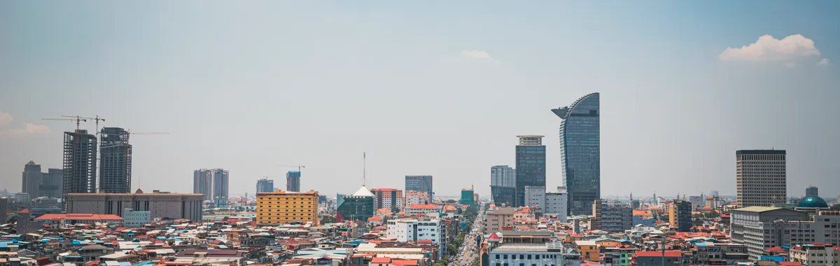 Discover the modern skyline and bustling streets of Phnom Penh from an aerial perspective.