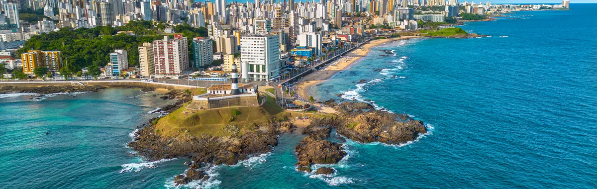 A vibrant aerial shot capturing Salvador, Bahia's coastline with its urban skyline and beach.