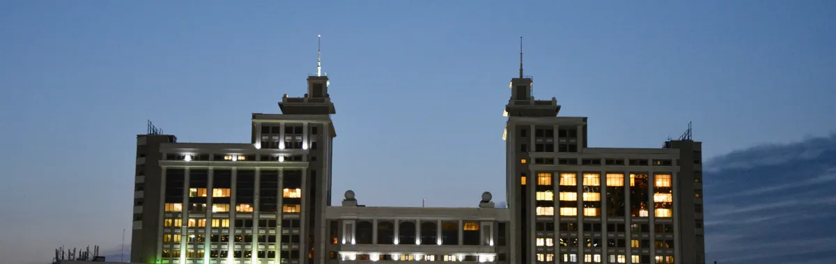 Majestic view of Astana's iconic architecture glowing against evening sky.