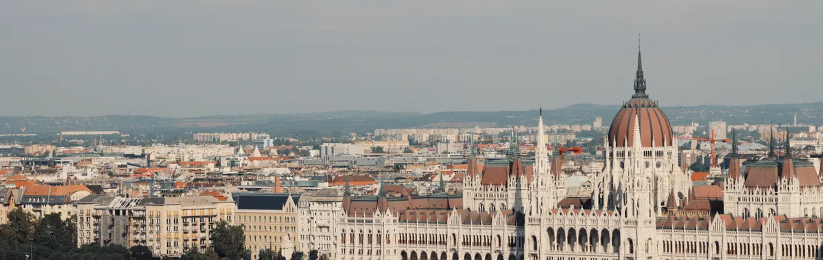 Scenic view of the iconic Hungarian Parliament Building along the Danube River in Budapest.
