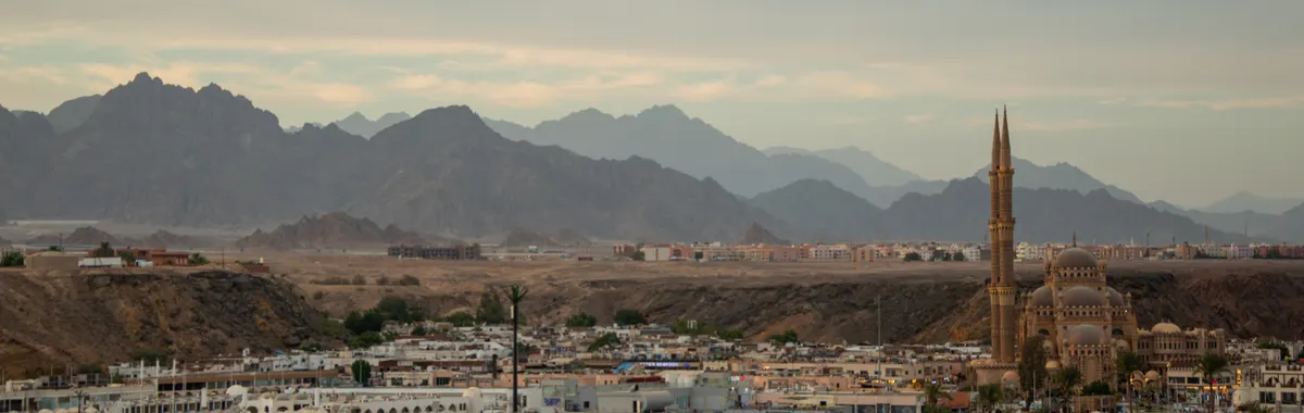 Breathtaking view of Sharm El Sheikh with mosque and desert mountains. Ideal vacation destination in Egypt.