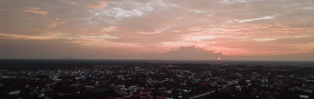 Captivating aerial view of Krong Siem Reap at sunset showing the cityscape and twilight sky.