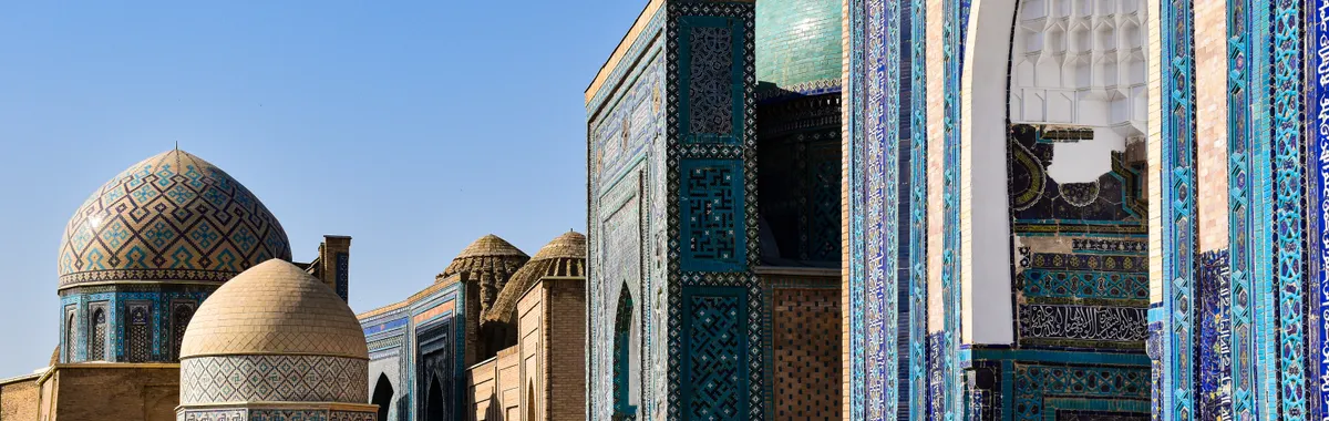 Explore the stunning architecture of Shah-i-Zinda, a historical necropolis in Samarkand, Uzbekistan, featuring intricate tilework.