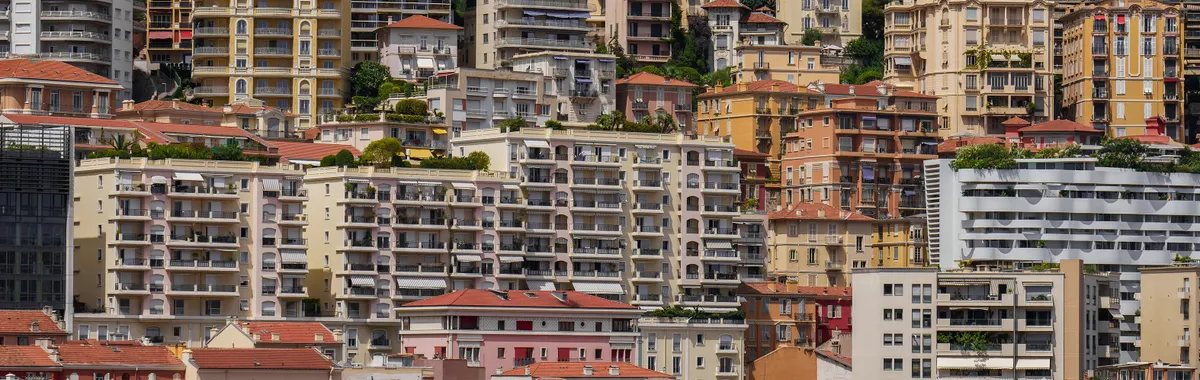 Experience the colorful and densely packed urban architecture of Monaco in this stunning cityscape photo.