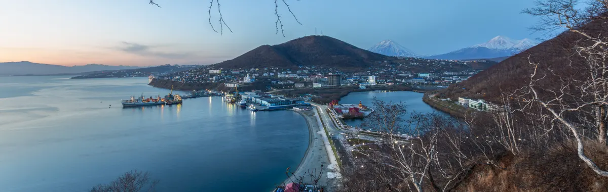 A breathtaking evening view over Avachinskaya Bay and Petropavlovsk-Kamchatsky City in autumn.
