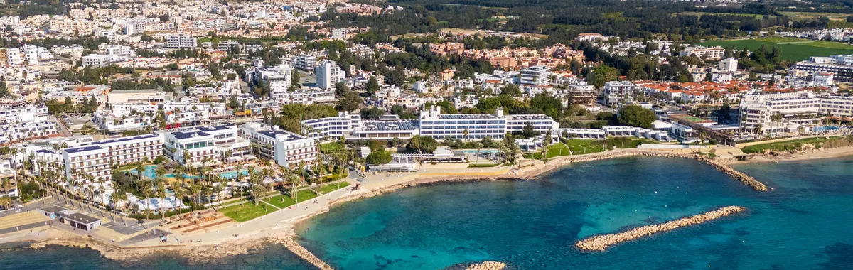 A comprehensive aerial view of Paphos coastline with clear blue waters.