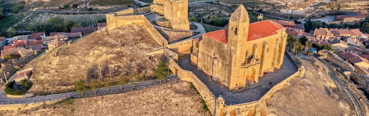 Stunning aerial view of historic castle in La Rioja, Spain at sunrise.