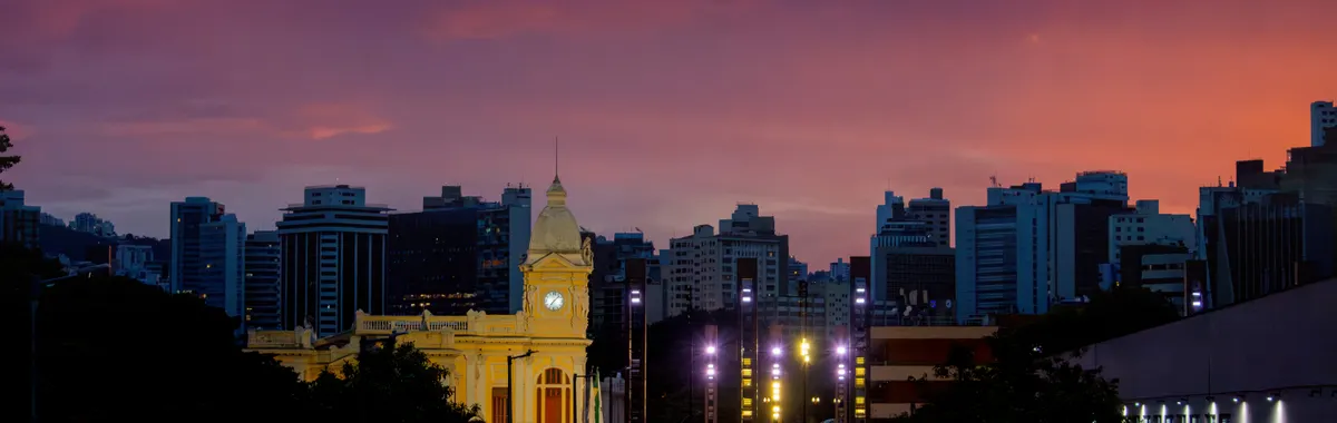 Stunning sunset over Belo Horizonte, featuring the historic architecture of Station Square with vibrant city skyline.