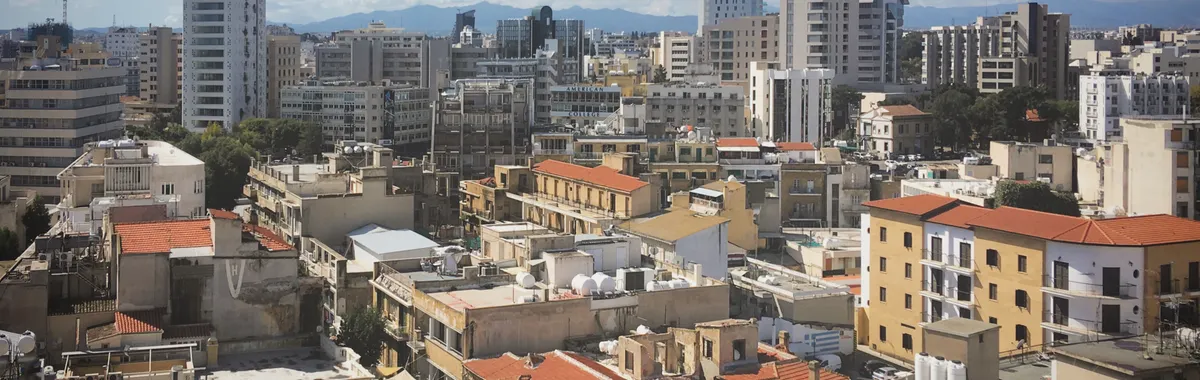 Skyline view of Nicosia's diverse architecture under a clear blue sky.
