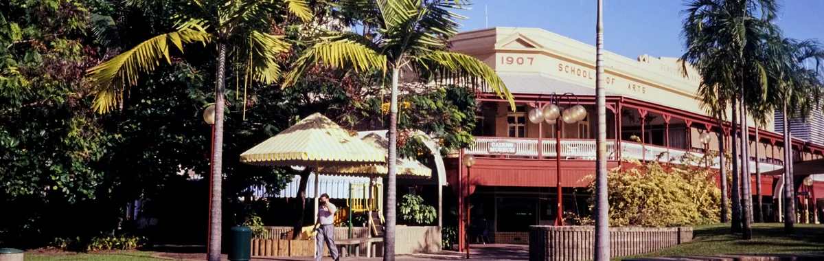 The 1907 School of Arts building with palm trees in Cairns, Queensland, Australia.