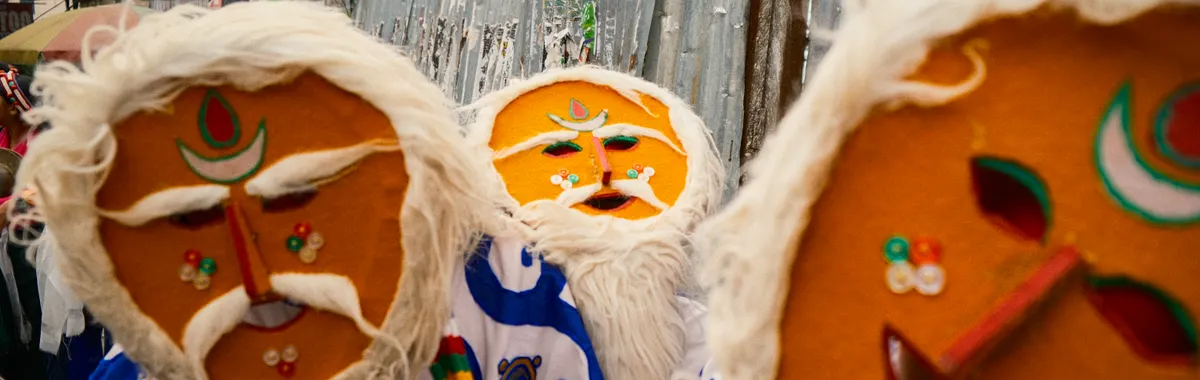 Colorful traditional masks worn during a festival in Dharamshala, India.