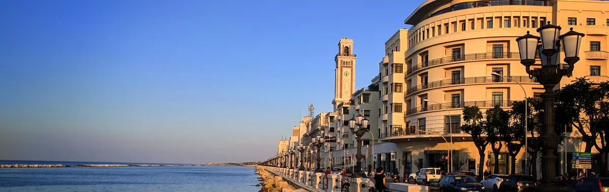 Breathtaking sunset view of the Bari waterfront in Italy with stunning architecture and Adriatic Sea.