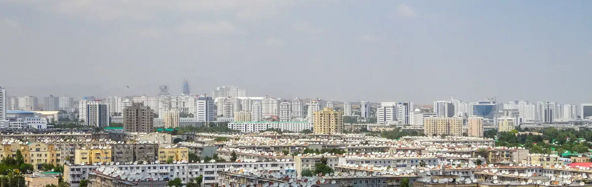 A vibrant aerial view of Ashgabat showcasing modern architecture and residential areas.